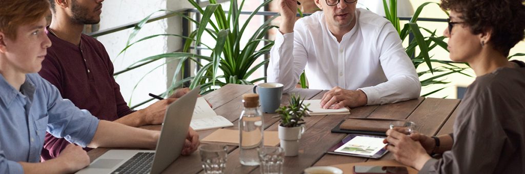 Technical SEO Consultant in Philippines 3 Group of People Working in big table - Technical SEO Consultant in the Philippines