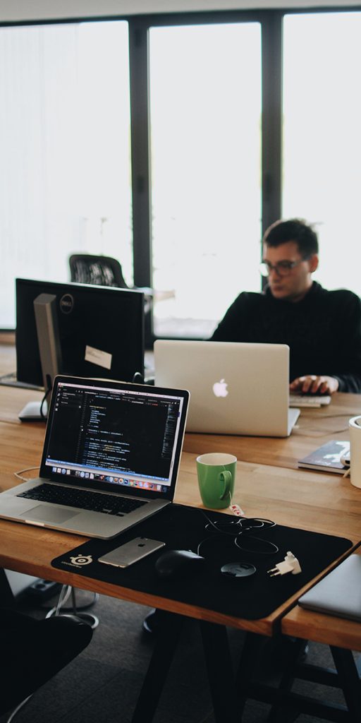 Technical SEO Consultant working in the table with comptuer