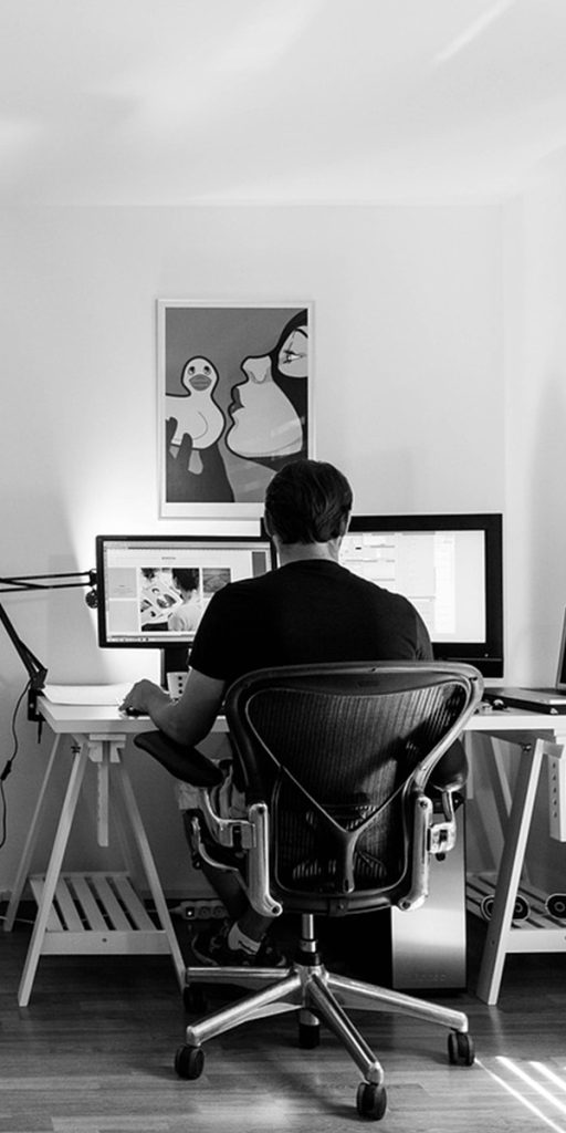 SEO Services Provider guy working on table with Desktop Computer